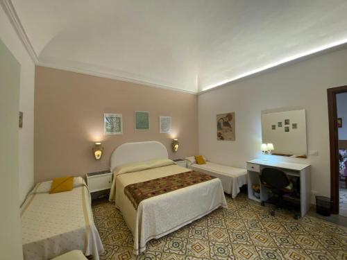Posteľ alebo postele v izbe v ubytovaní La Casa dei Fiori
