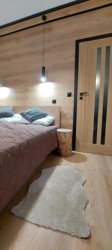 Katil atau katil-katil dalam bilik di Apartamenty Trzy Kopce Ski & Bike & Sauna