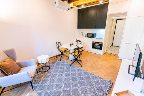 a living room with a couch and a table at Dream Suites Milano Brisa Meravigli in Milan