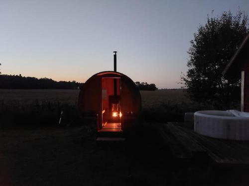 a small tent in the middle of a field at Stuga Gasstorp Wifi in Hova