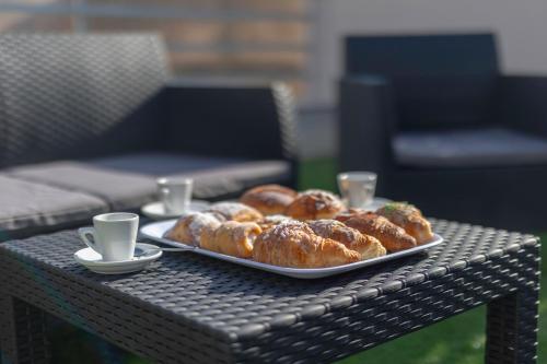 a plate of pastries sitting on top of a table at Elysium B&B in Mazara del Vallo