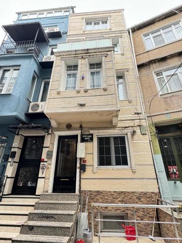 an old house with stairs in front of it at Plaesant apartment with Balcony in Istanbul