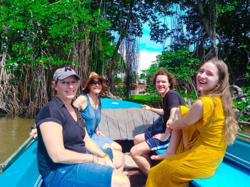 a group of women sitting on a boat in the water at Lucky Prince Villa in Aluthgama