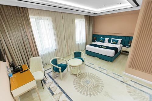 Postel nebo postele na pokoji v ubytování HOTEL SULTAN PALACE