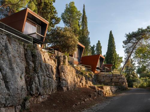 a house built on a rock wall at Porton Nature Hideouts in Rovinj