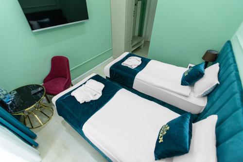 Postel nebo postele na pokoji v ubytování HOTEL SULTAN PALACE