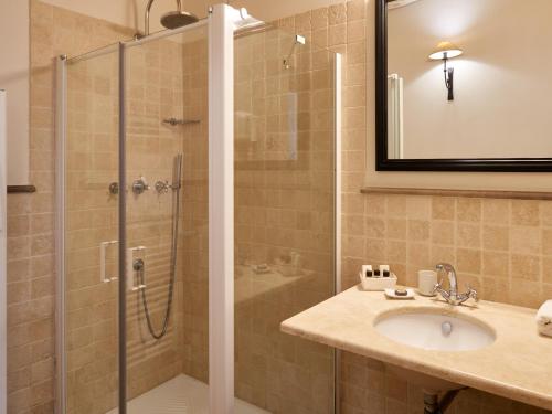 a bathroom with a shower and a sink at Pamperduto Country Resort in Porto Potenza Picena