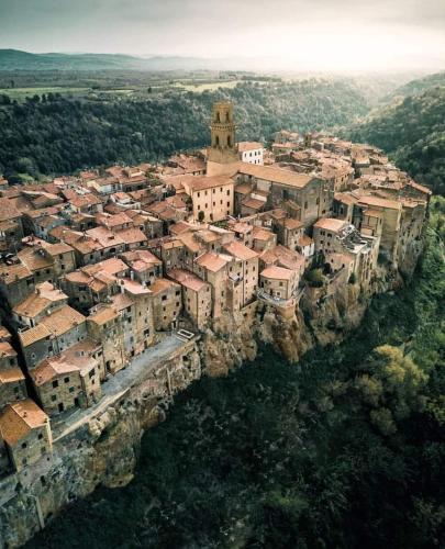 an aerial view of a village on a cliff at casa il Girasole Pitigliano in Pitigliano