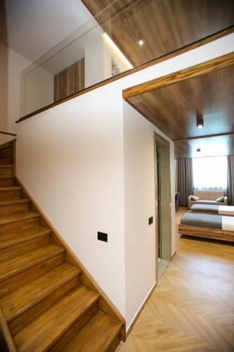 a staircase leading to a bedroom in a house at Belvedere Hotel & SPA in Vlorë