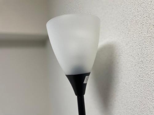 a white light on a wall next to a wall at パルム天神西 in Susakiuramachi