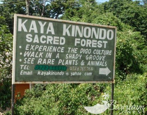 a sign for a kaya kimonga sacred forest at Barizieum Nest 1BR, Diani in Kwale