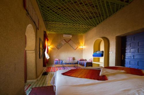 Postel nebo postele na pokoji v ubytování Kasbah Hotel Panorama