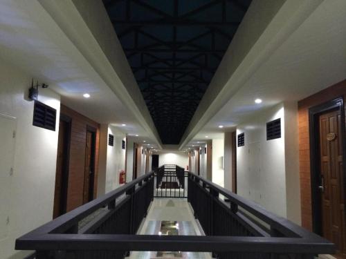 an empty hallway in a building with a ceiling at The Green Hotel in Ko Lipe