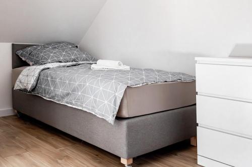 Postel nebo postele na pokoji v ubytování „MAZURSKIE PTAKI” Domki Letniskowe