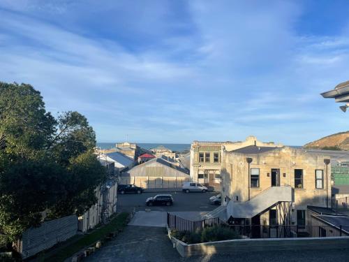 a view of a street in a city with buildings at Little Sweetie in Oamaru