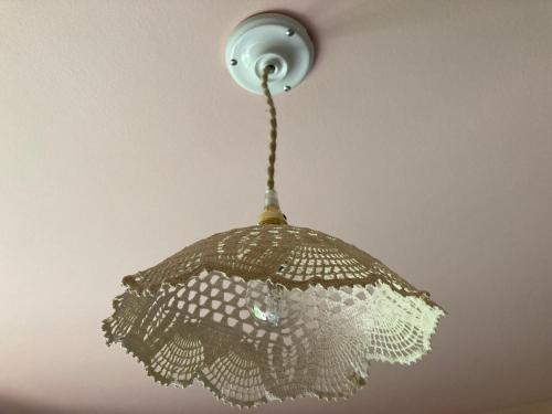a light hanging from a ceiling at Casa Bauxells in Sahorre