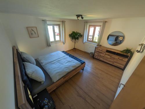 a bedroom with a bed and a tv in it at Ferienwohnung Elisabeth in Bischofswiesen