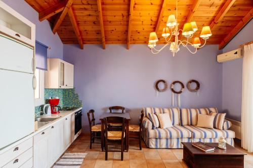 a living room with a couch and a table at Apelon Tiritas Villas in Leonidion