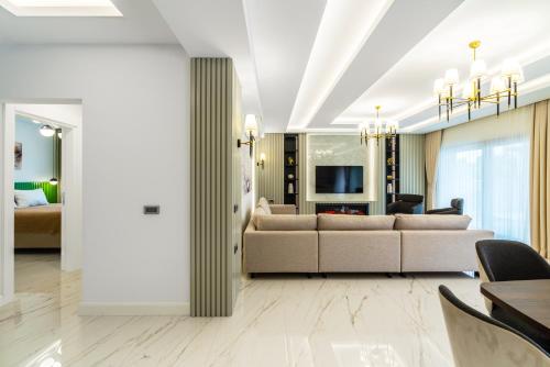 a living room with a couch and a table at Edem Villa Diamond in Kemer