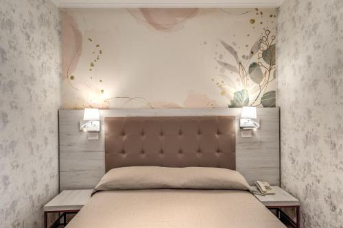 Postel nebo postele na pokoji v ubytování Hotel Milo