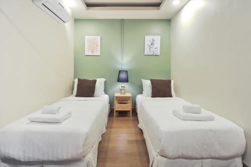 Ένα ή περισσότερα κρεβάτια σε δωμάτιο στο Ployburi Boutique Hotel
