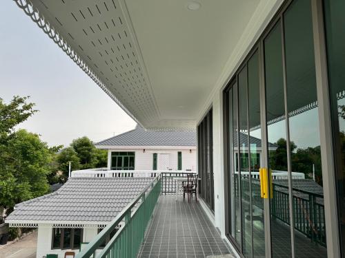 an external view of a building with a balcony at Pailin Pool Villa,HuaHin in Hua Hin