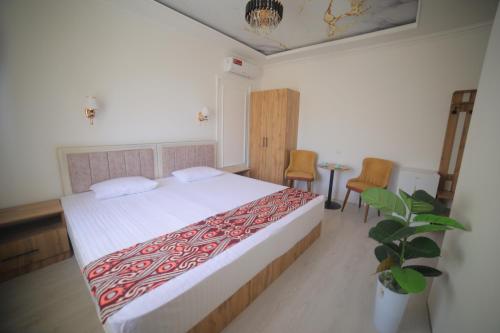 Katil atau katil-katil dalam bilik di Annex Hotel Khiva