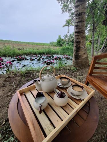 a tea set on a wooden tray on a table at Harmony Haven, Udawalawe, Sri Lanka in Udawalawe