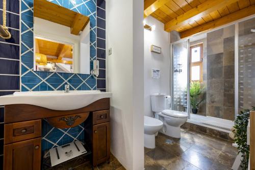 a bathroom with a sink and a toilet at Hideaway Nature by Seewest in Saragoçal