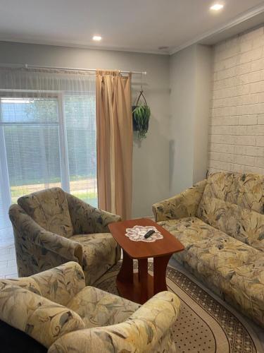 a living room with a couch and a table at Будинок для відпочинку Dana in Berehove