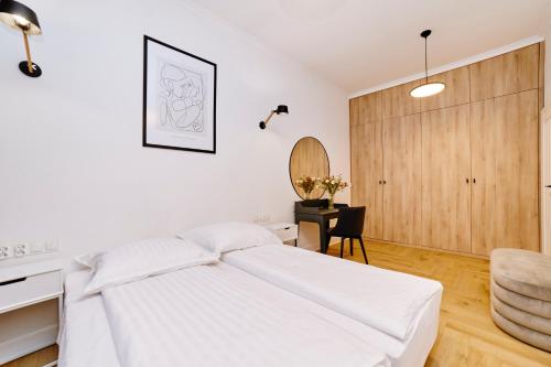 Ένα ή περισσότερα κρεβάτια σε δωμάτιο στο Apartamenty centrum
