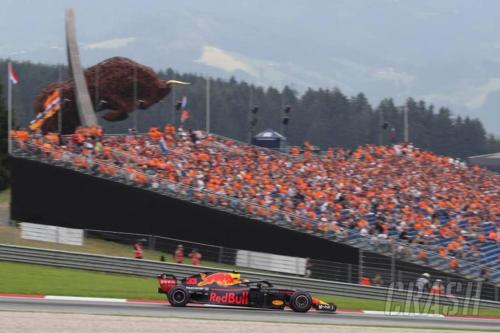 a race car in front of a crowd of people at Charmante Ferienwohnung in Vordernberg - Alpenidylle pur in Vordernberg