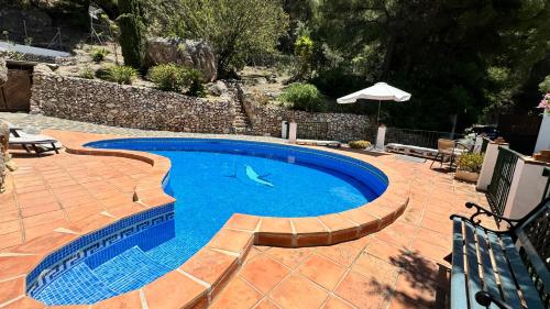 Bazén v ubytování Cortijo El Majito nebo v jeho okolí