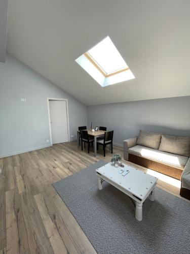 a living room with a couch and a table at Apartment 5 confort&modern in Arad