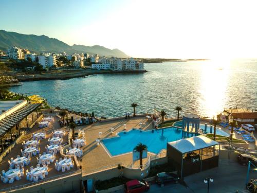 an aerial view of a resort with a body of water at DOME HOTEL & CASINO at Central Kyrenia in Kyrenia