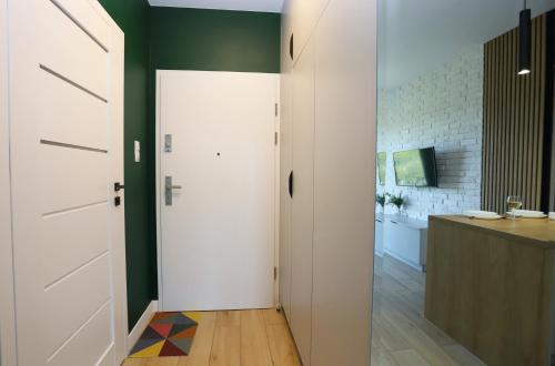 Postel nebo postele na pokoji v ubytování Apartament Zielone Podwale