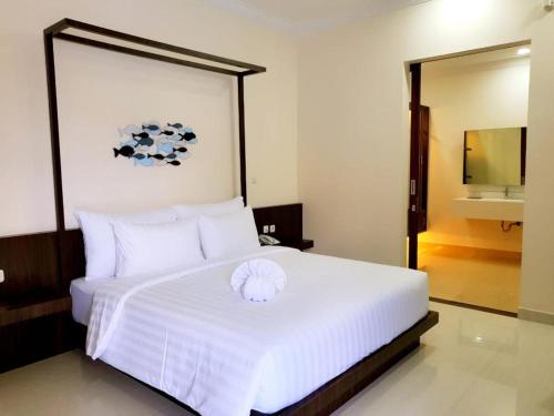 Postel nebo postele na pokoji v ubytování New Belitung Holiday Resort