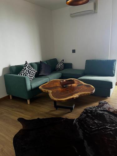 a living room with a couch and a coffee table at Koh Tao studios in Koh Tao