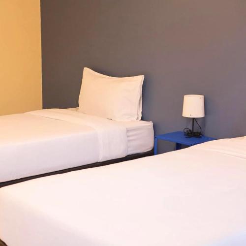 Postel nebo postele na pokoji v ubytování Intha Resort