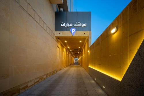 a hallway of a building with a sign on the wall at Donatello Jeddah Hotel in Jeddah