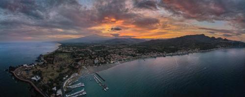 an aerial view of a city on the water at Belduomo in Taormina