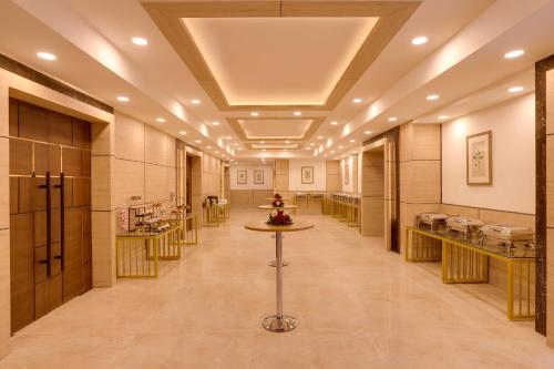 a long hallway with aasteryasteryasteryasteryasteryasteryasteryasteryasteryasteryastery at Lemon Tree Hotel, Rishikesh in Rishīkesh