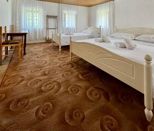 Postel nebo postele na pokoji v ubytování Guest House Noku
