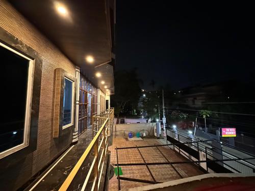 a balcony of a building at night at THE VISTA RESIDENCY in Guwahati
