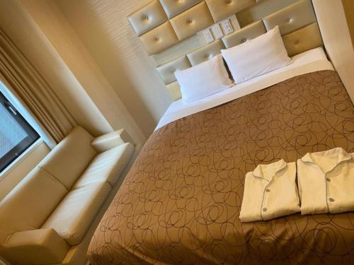 Hotel Relief SAPPORO SUSUKINO - Vacation STAY 22958vにあるベッド
