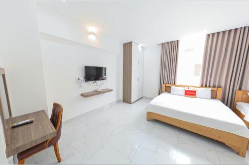 Postel nebo postele na pokoji v ubytování Tuyet Lan Hotel Vung Tau