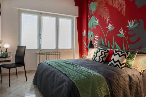 Postel nebo postele na pokoji v ubytování 56 direttamente sul mare - red tropical