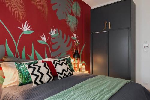 Postel nebo postele na pokoji v ubytování 56 direttamente sul mare - red tropical