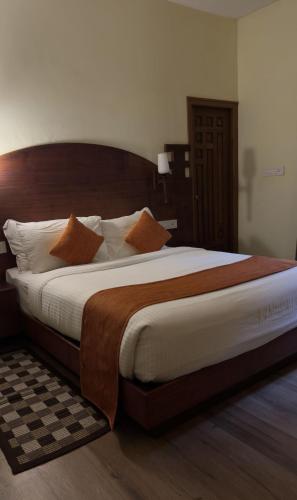 Postel nebo postele na pokoji v ubytování Indeevara Luxury Resort and Spa, Wayanad