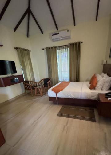 Postel nebo postele na pokoji v ubytování Indeevara Luxury Resort and Spa, Wayanad